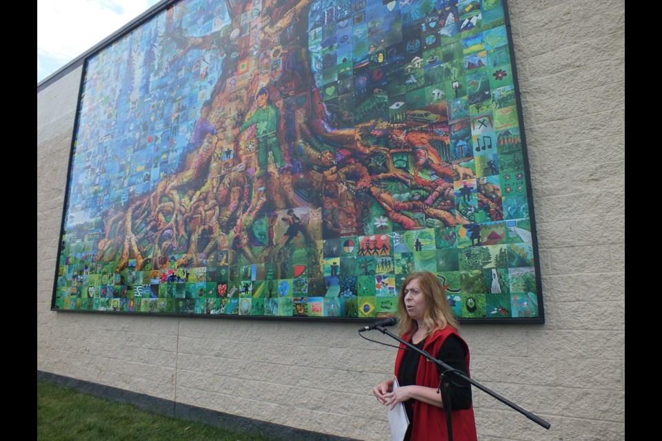 Marina Chabbert, president of Cochrane and Area Events Society at the unveiling of the “Cochrane Together - A Remembrance” mural mosaic project Friday morning at The Station.