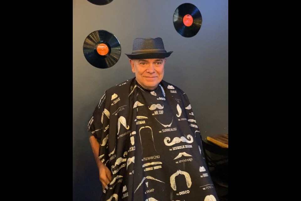 Fred Burley smiles following his head shaving for sarcoma cancer research on May 25 at 1861 Local Bar and Grill