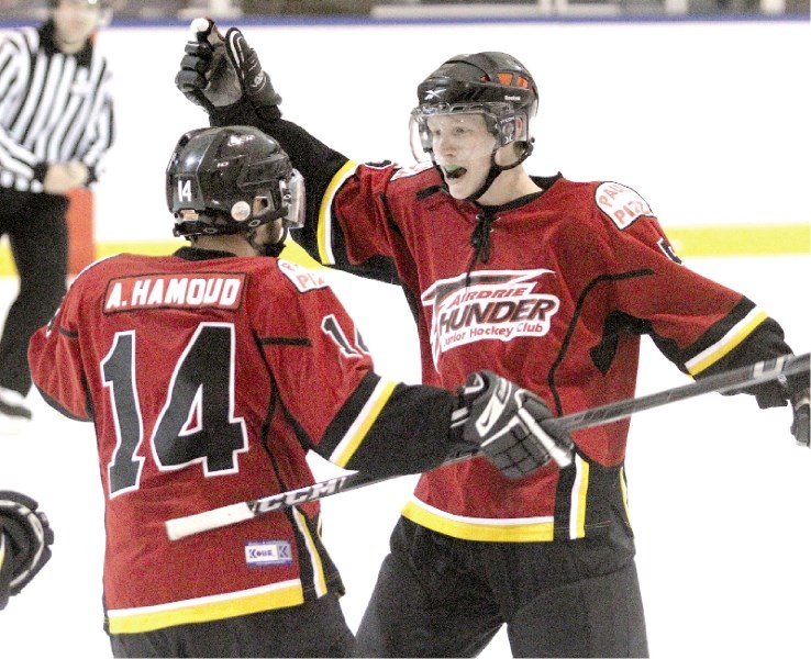 The Airdrie Thunder&#8217;s Abdo Hamoud (left) and Tannor Kocis (right) celebrate the Thunder&#8217;s game winning goal during the team&#8217;s 4-3 win over the Cochrane