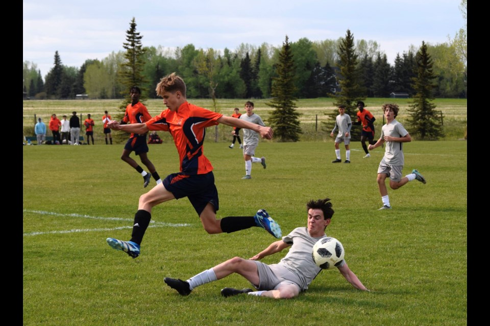 The Springbank Phoenix (grey) defeated the W.H. Croxford Cavaliers 4-3 in extra time to set up a league championship showdown versus the Cochrane Cobras.  