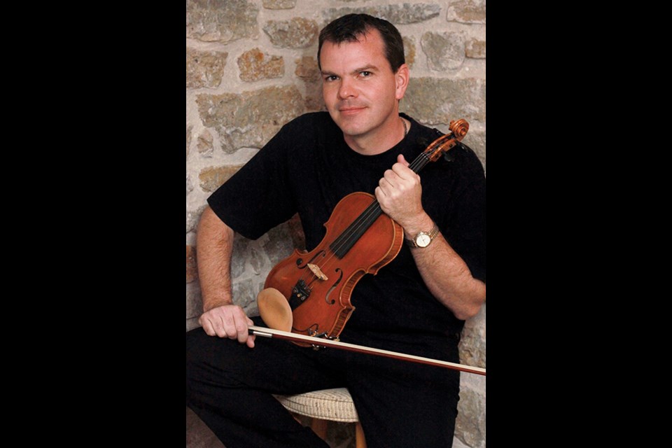 Fiddle master Scott Woods is bringing his band to Alberta this October.