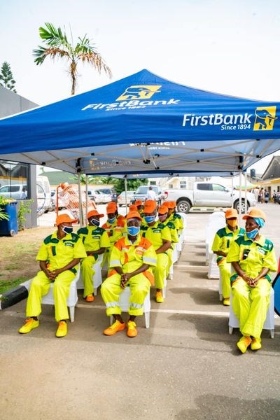 Sanwo Olu gives uniform branded by First bank to LAWMA sweepers