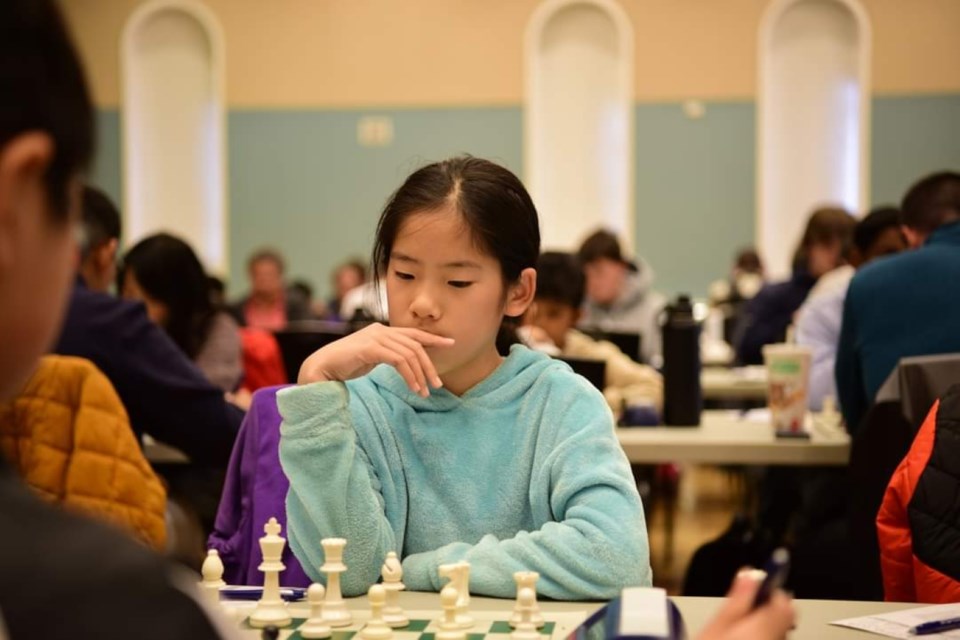 Newmarket student Ashley Qian considers her move during a tournament last year.