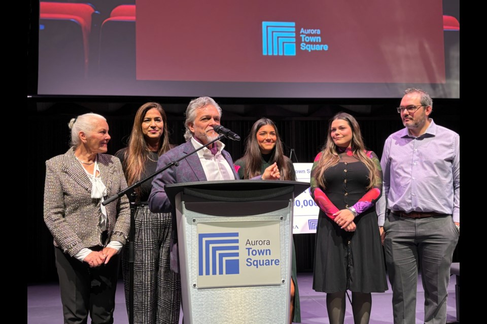 Family members, including son Marco (at podium), attended the official naming of  the Aurora Town Square performance hall after Royalpark Homes founder Davide De Simone on Nov. 20. 