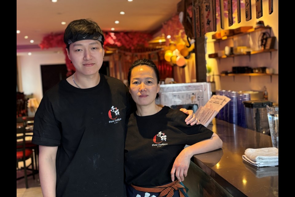 Co-owners of Feza Izakaya and mother and son Evan (left) and Kiki Tang.