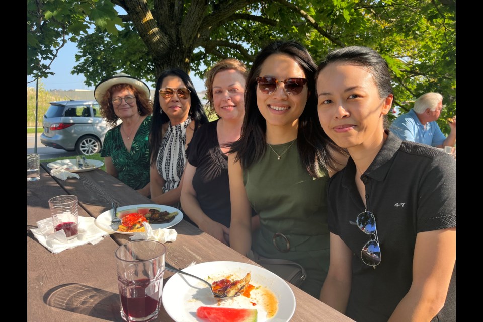 York Region Food Network board members Suzette Seveny (from left), Nina Doiron, Rebecca Kopel and Hilda Lam, and supporter Priscilla Chung enjoy the charity's appreciation barbecue for volunteers and supporters Aug. 14 in Aurora. 