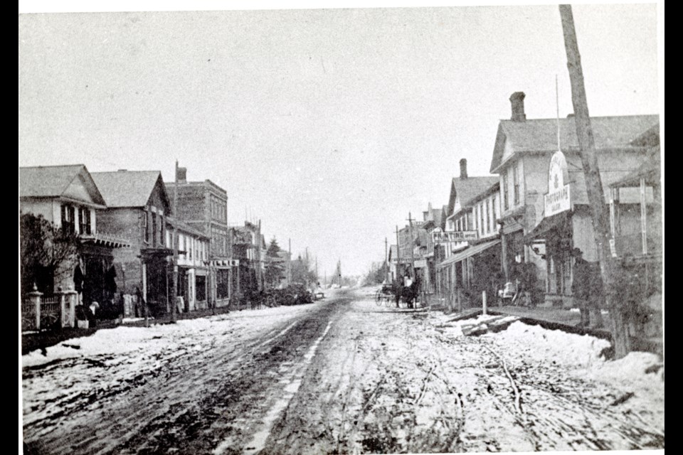 Yonge Street, Aurora, looking north from near Mosley and Tyler streets, circa 1875. The Faughner Block (15222 Yonge St.), completed in 1875, north of the Willis sign, may be under construction. No ‘skyscraper’ Medical Hall (1886) is seen on the east side.