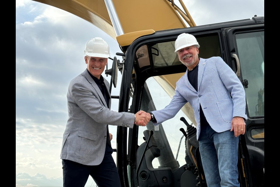 Declain Sinclair, owner of Bayvest, and Aurora Mayor Tom Mrakas shake hands at the ground-breaking ceremony on Wednesday, Oct. 23.