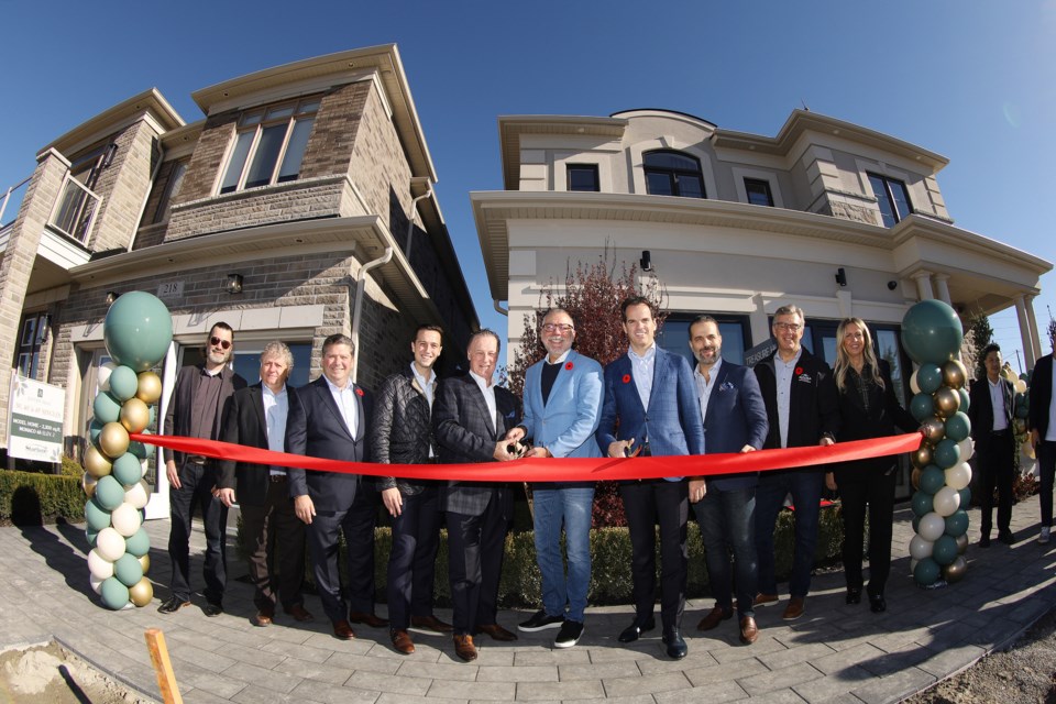 Gabriel Baldassarra and Mauro Baldassarra of Starlane Homes to the left of Aurora Mayor Tom Mrakas with Nicholas Fidei and Json Baltoni of Treasure Hill to the right.