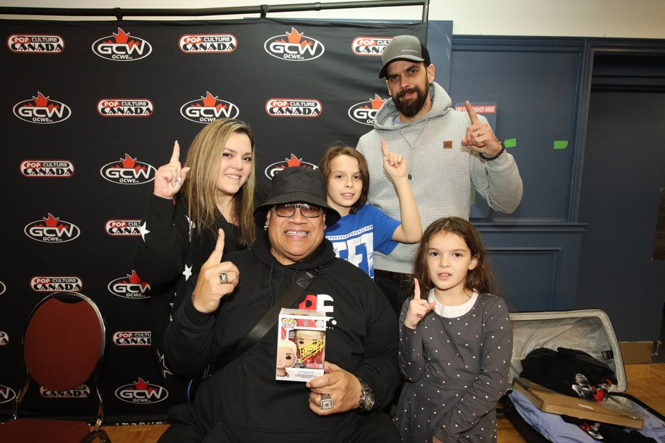 Angela and Justin, with daughters Olivia and Madison, meet WWE Hall of Famer Rikishi at the Great Canadian Wrestling event at the Aurora Legion Sunday.