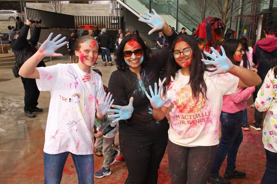 Holly Ryman, Sharade Sunil, and Saanvi Sunil wish you a happy Holi, at the Town of Aurora's Holi celebration Saturday at Aurora Town Square.