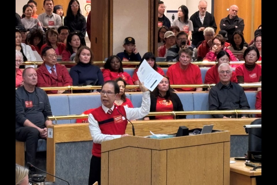 Several residents spoke in support of Mayor Tom Mrakas' veto, including Ki Kit Li, during the special council meeting on Tuesday, March 18.