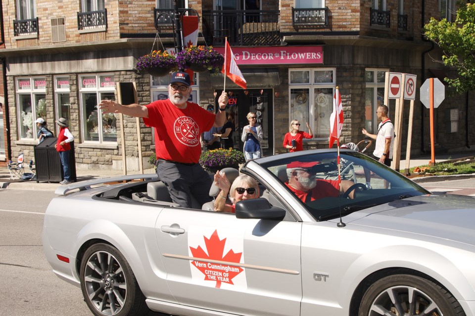 The top was down on a beautiful Canada Day for Aurora Citizen of the Year Vern Cunningham as the parade wends its way down Yonge Street July 1.