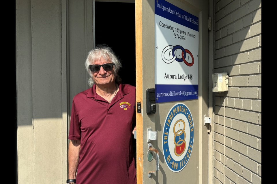 Anthony Garramone, vice grand of the Independent Order of Odd Fellows Aurora Lodge 148, opens the door to the lodge on Yonge Street.