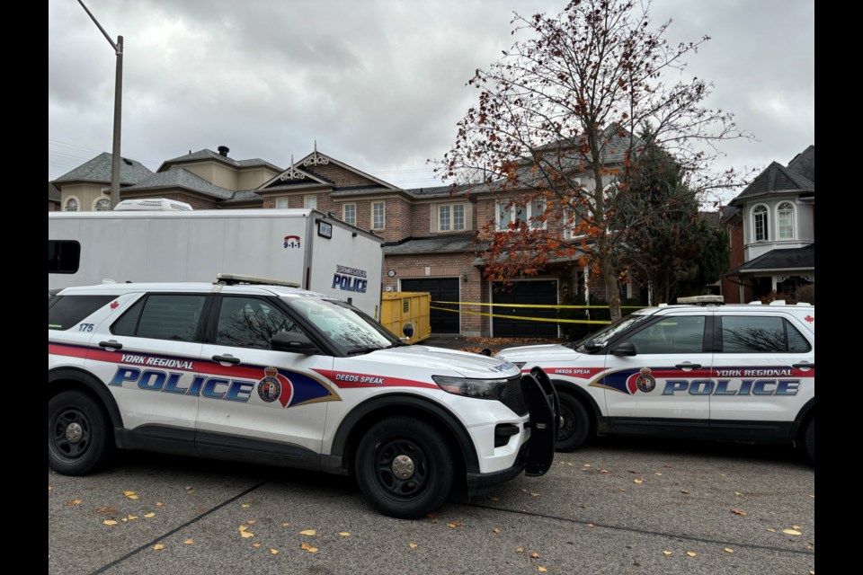 Two Downey Circle houses remain cordoned off Friday morning.