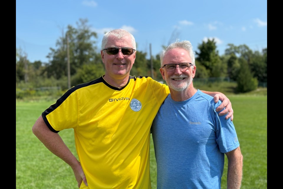 Former president Martin Ambrose, left, and current club president John Aird.