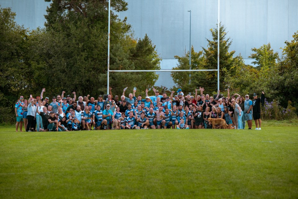 The Aurora Barbarians pose for a last team photo at the now shuttered Fletcher's Fields.