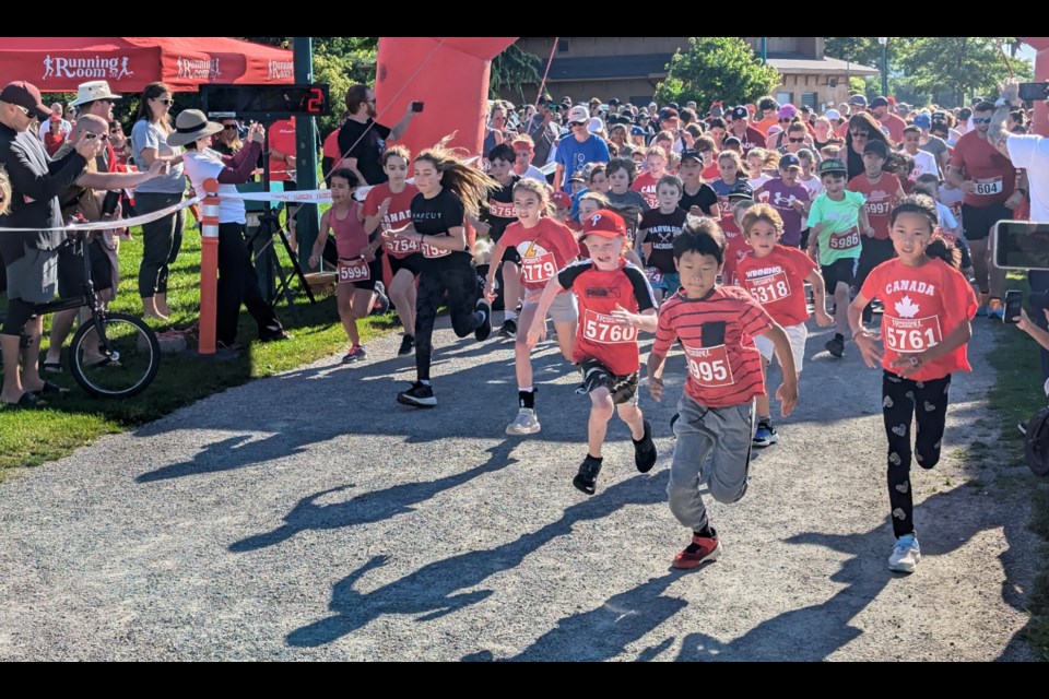 Youths start the Running Room Barrie Canada Day races in Barrie's  Heritage Park.