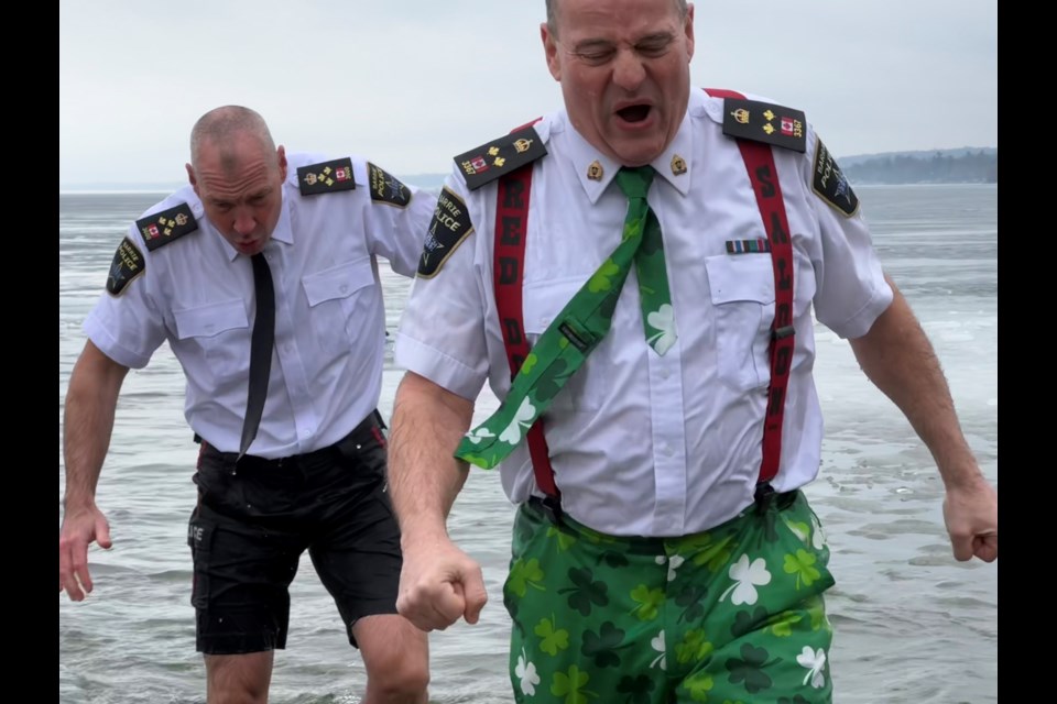 Barrie police Chief Rich Johnston and Deputy Chief Rob Burke brave the icy water of Kempenfelt Bay as part of the annual Polar Plunge in support of Special Olympics Ontario.