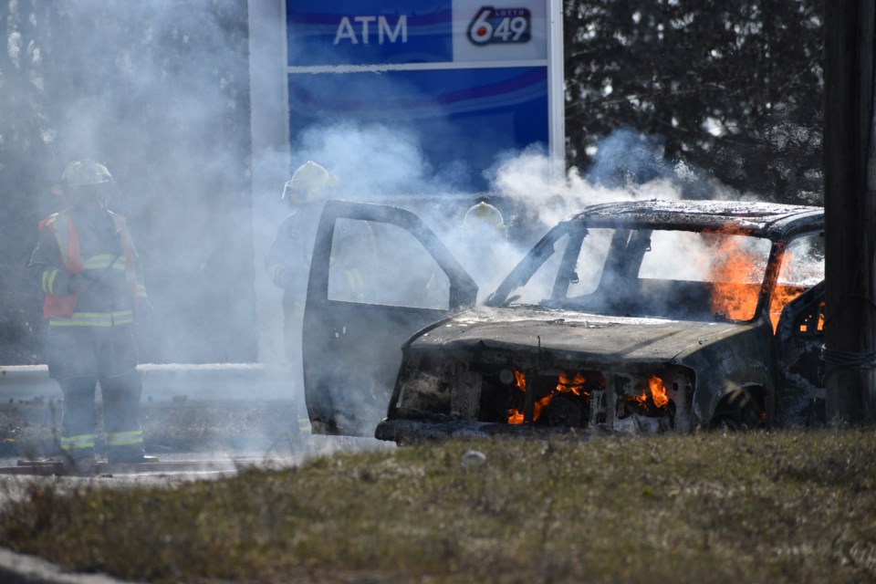 Oro-Medonte fire crews work to extinguish a truck fire in a parking lot off Highway 11, just north of Barrie, on Tuesday afternoon.