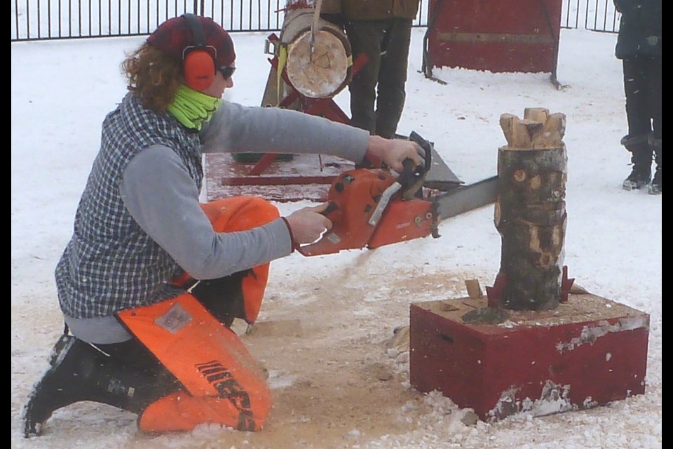 Lumberjack Wyatt does a little chainsaw work at Barrie Winterfest on Saturday.