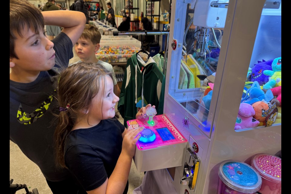 Nate and Ava Widemann of Orillia try to win a prize at Sunday's Barrie Game Exchange, which drew about 1,000 people to Eastview Arena throughout the day.