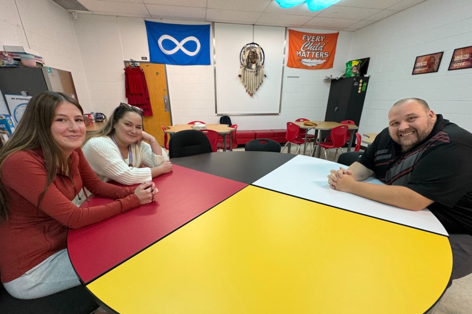 Grade 11 student Jorga Lamoureux, Indigenous graduation coach Shyanne Woodcock and Eastview principal Tyson Maxwell are shown in "The Lodge," a space within the Barrie high school designed to welcome and support students and encourage learning about Indigenous culture and history.