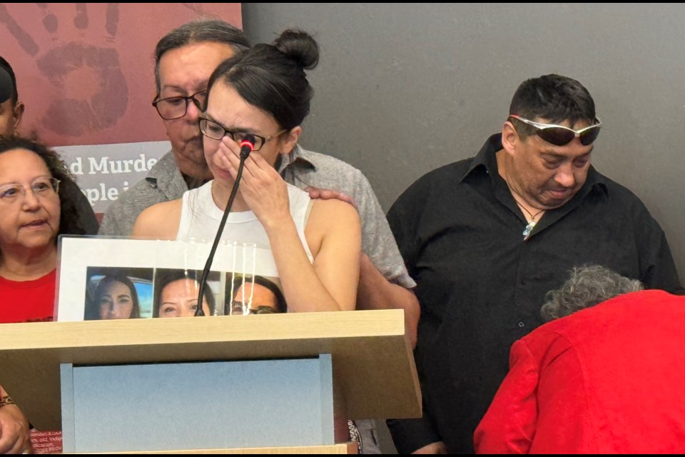 Lili-Anne Moore wipes away tears during a news conference on Friday to try to bring awareness to the disappearance of her sister Autumn Shaganash in June 2023. 