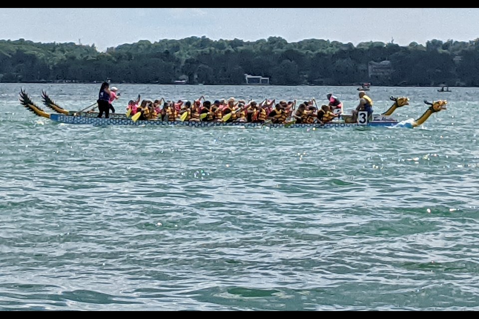 Two dragon boats race toward a photo finish during Saturday's festival in Barrie.