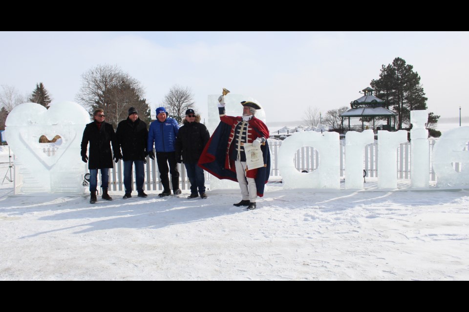 Coun. Mike McCann was joined by local MPs Doug Shipley and John Brassard, fellow Coun. Gary Harvey, and town crier Steve Travers on Saturday at the Heart Barrie ice sculpture in Heritage Park.