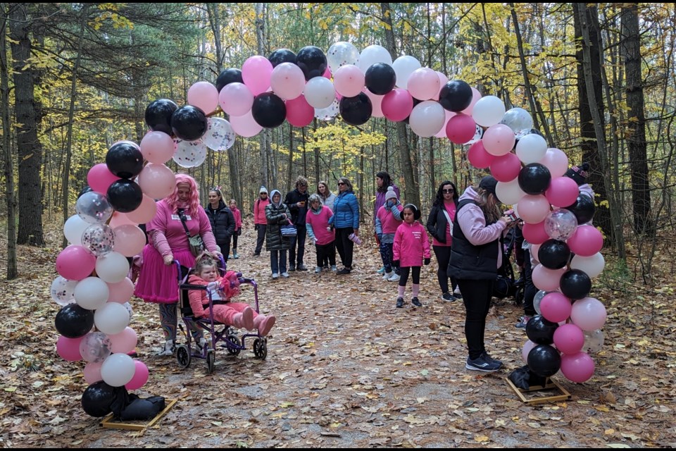 Registering for Sunday's Down Syndrome Walk in Springwater Township.