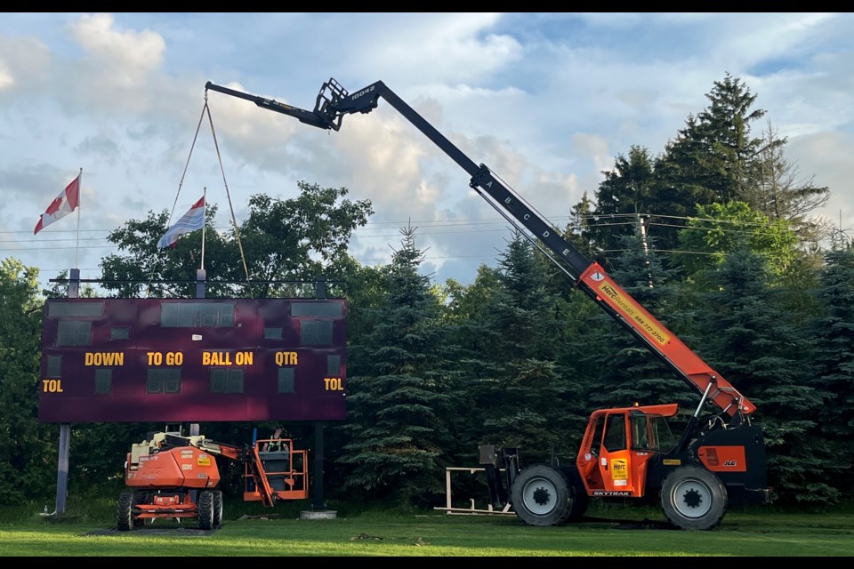 A crew installs a new scoreboard at Barrie Community Sports Complex in Midhurst. 