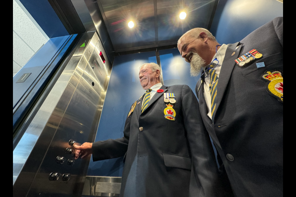 Royal Canadian Legion Branch 147 president Marcel Vigneault and Chuck Arrand, zone commander for area legions, get ready to make their way up to the second floor in the Barrie legion's new elevator.