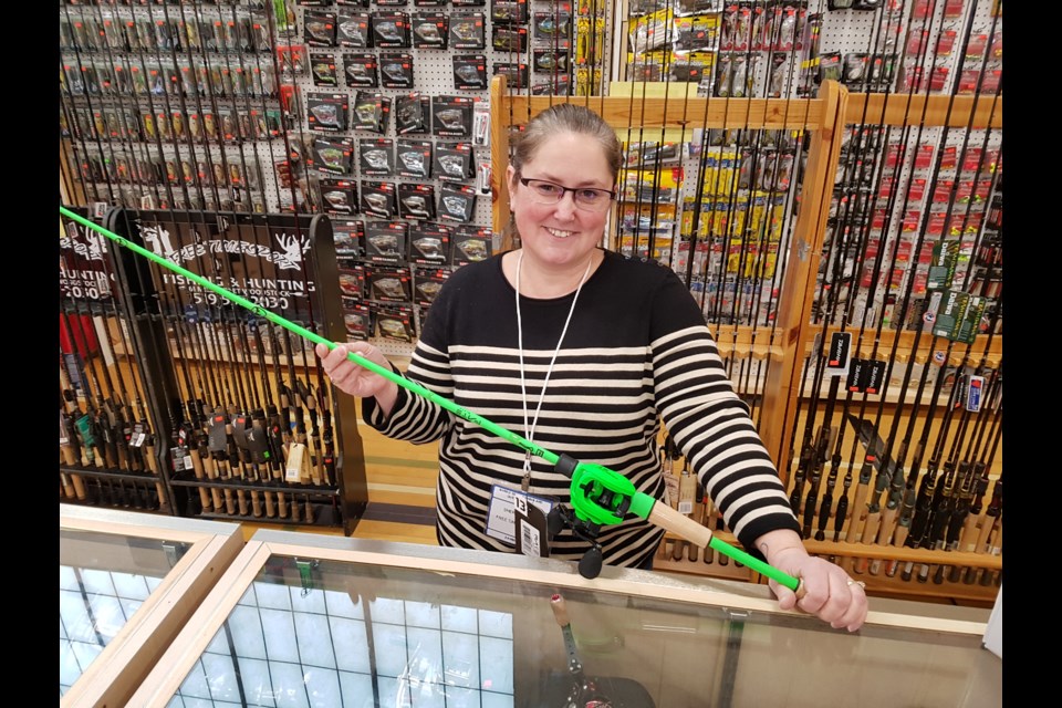 Sheri Major of Free Time Sports shows off one of the more colourful fishing rods her company offers, Sunday, Feb. 9, 2020. Shawn Gibson/BarrieToday