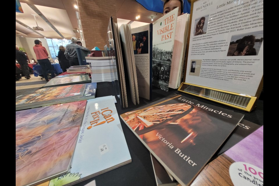 Books by local authors lined the tables at the downtown Barrie Public Library during the Local Author Book Market, Saturday, Dec. 3, 2022.