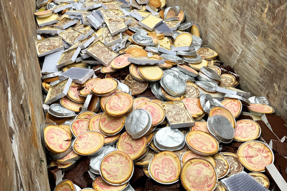 Just a few of the 1,600 discarded cheesecakes sitting in a dumpster at Pfalzgraf Patisserie on Saunders Road in Barrie after smoke damage from a fire in an adjacent business on April 23.