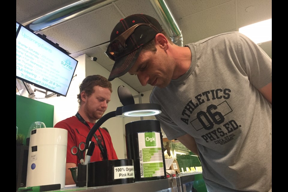 A client checks out some product at the Sunrise Medicinal pot dispensary in downtown Barrie.  Sue Sgambati/BarrieToday