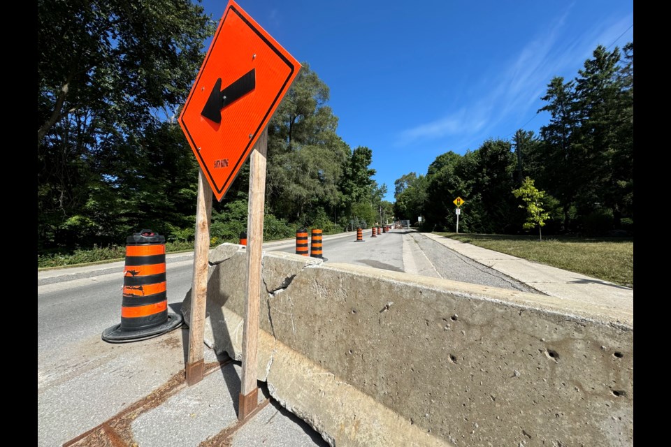 Traffic is reduced to one way at the intersection of Finlay Mill and Wattie roads in Midhurst, as shown on Thursday.