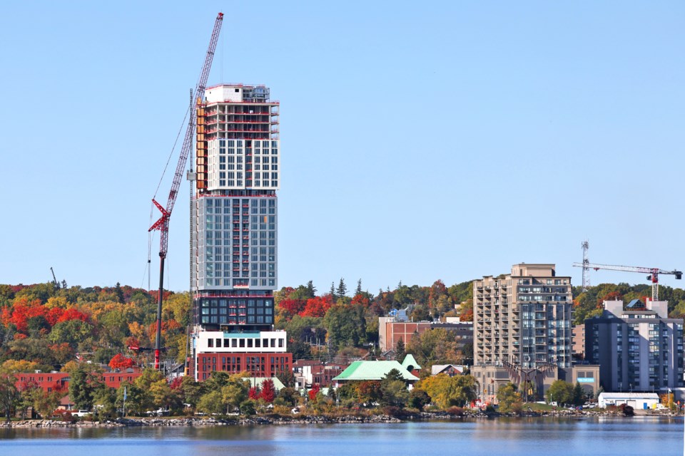 The removal of a crane from the top of the highrise building at 55 Dunlop St. W. under construction with another much larger crane in downtown Barrie on Oct. 17.