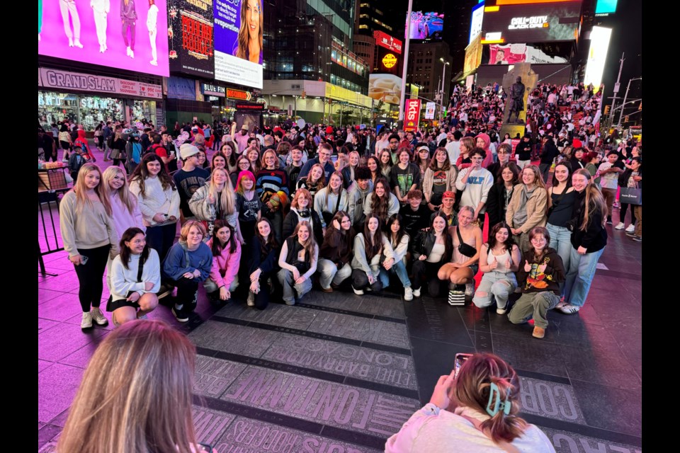 Local students gather in Times Square during a recent school trip to New York City. 