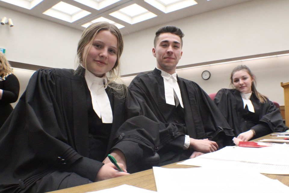 The 2019 Simcoe-Muskoka Mock Trial competition was held Thursday night at the Barrie courthouse. The Patrick Fogarty Catholic Secondary School team was among those who competed. The group included, from left, Kaitlyn Roberts, Joey Healy and Rachel Stong. Raymond Bowe/BarrieToday