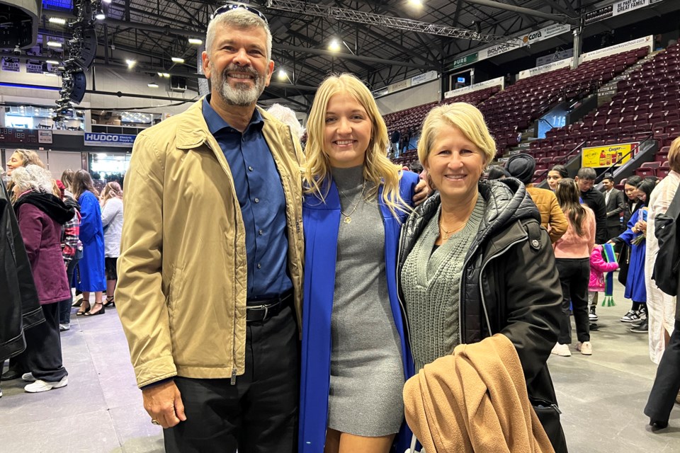 Newly minted graduate Edan McFadden, of Orillia, with her parents at a Georgian College convocation ceremony held Monday morning at Sadlon Arena in Barrie.