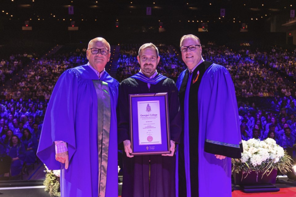 Georgian College alumnus Ali Khonsari, centre, with Steven Lowe, left, and Kevin Weaver, right, received a Board of Governors’ honorary honours bachelor of business administration degree during a convocation ceremony June 19.