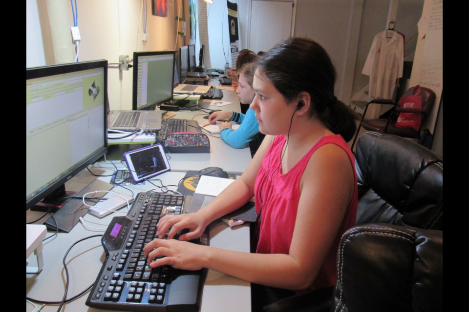 Camp participant Avery Lowe​ works on her story. Photo by Shawn Gibson for BarrieToday. 