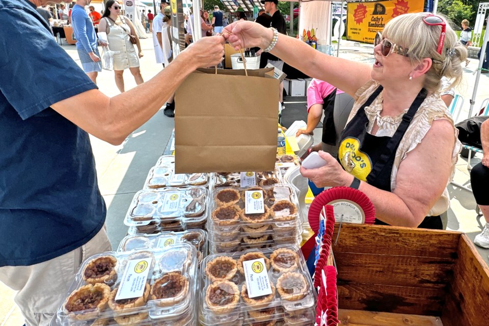 A vendor does brisk business at the inaugural Barrie Butter Tart Festival on Saturday in the city's downtown.