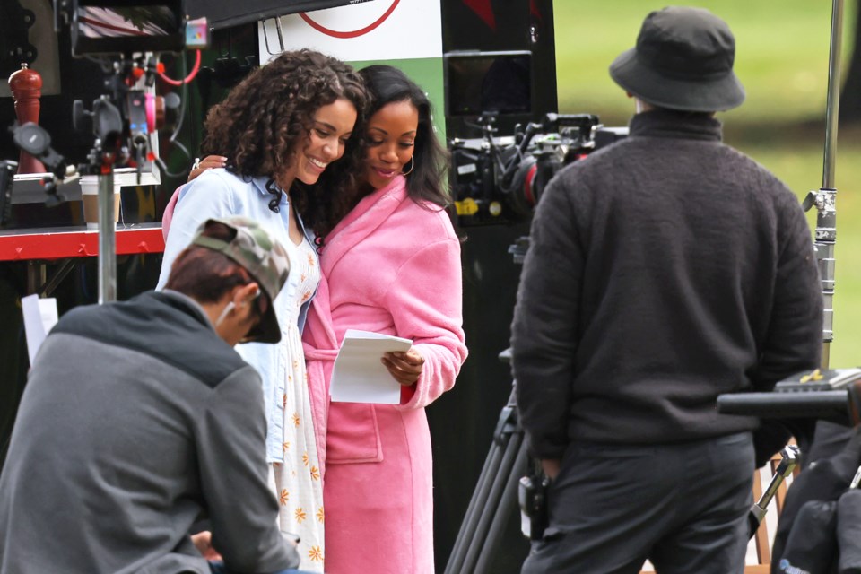 Actors review their lines in between takes on a film set in Sunnidale Park in Barrie on Wednesday.