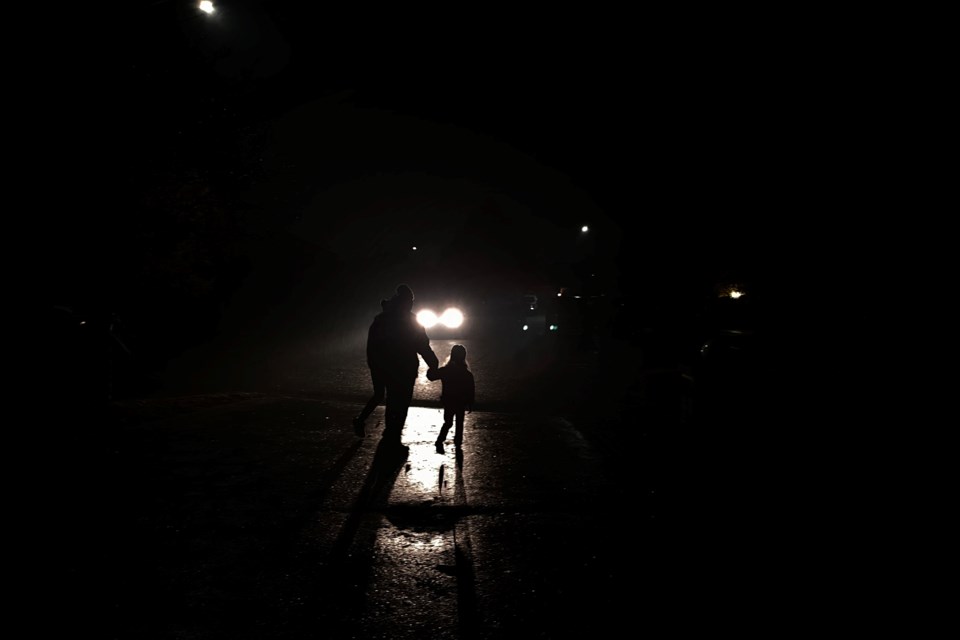 A father and daughter leave the Haunt on Higgin in Barrie on Friday night.