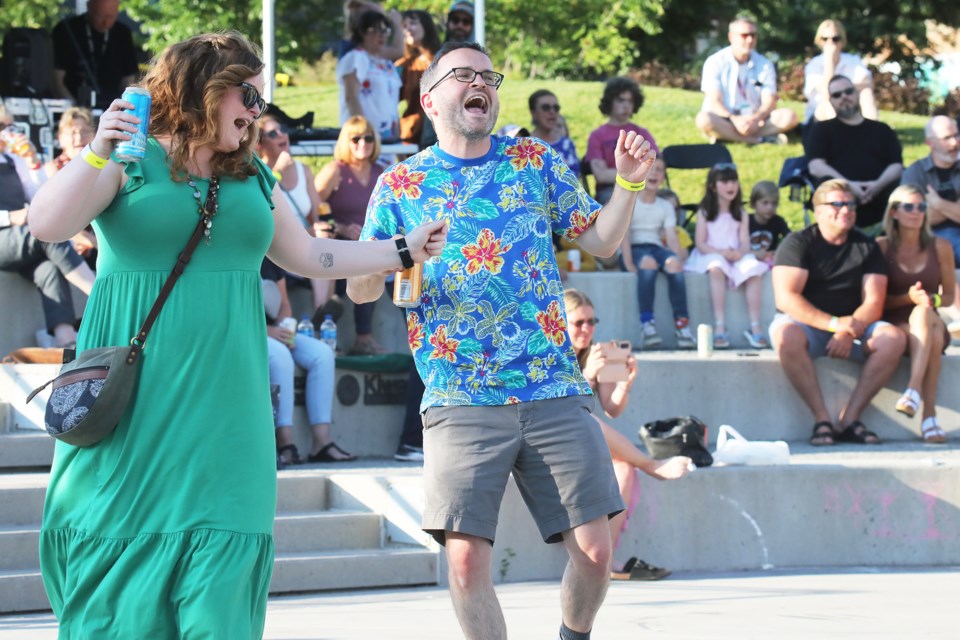 Happy dancers celebrate live summer music at the Troubadour Festival on Friday night at Meridian Place. The festival continues today. For more information, check out troubadourfestival.ca/.