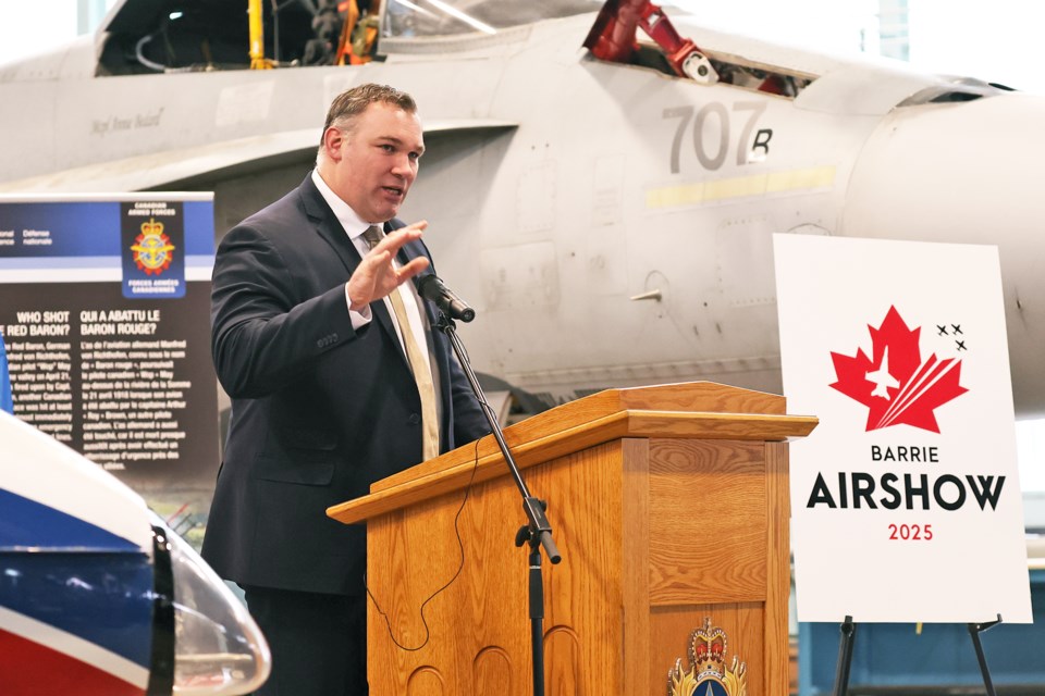 Barrie Mayor Alex Nuttall speaks to an audience in a hangar at Canadian Forces Base Borden on Tuesday as it is announced the Barrie Airshow will return on June 7 and 8 over Kempenfelt Bay.