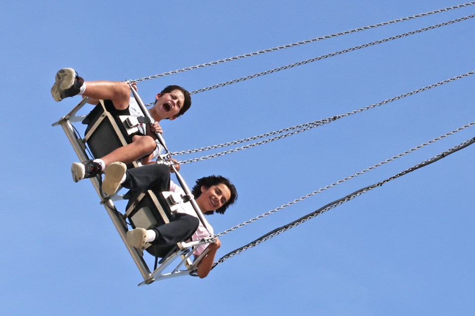 Yells and screams ring out as kids try out carnival rides at the Barrie Fair at the Essa Agriplex in Thornton on Sunday.